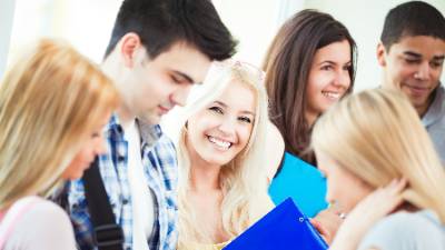 Group of students standing in group with registeration materials