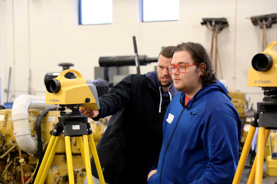 Students with a digital level