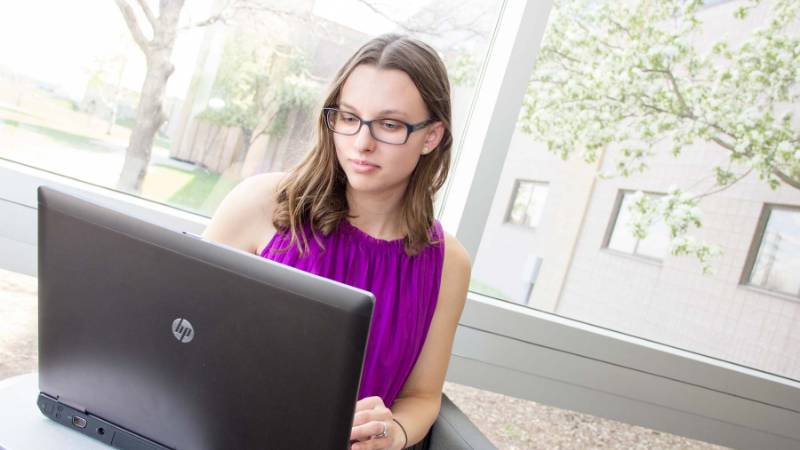 Female Student with Laptop