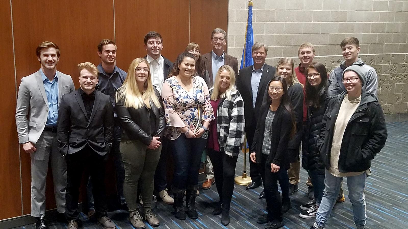 Marketing managment students and instructor with speaker Brian Dodge
