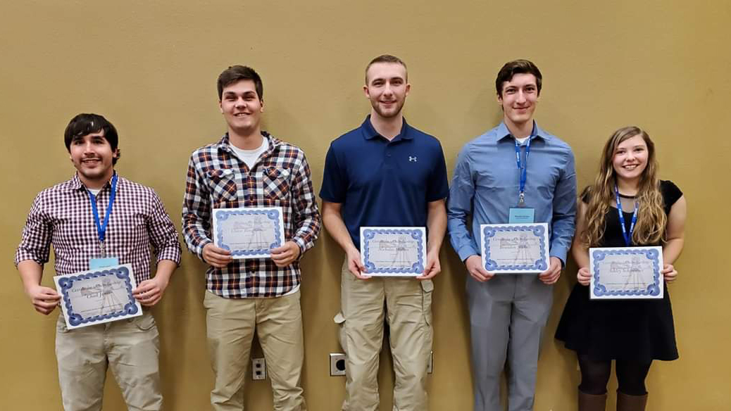 Students with scholarship certificates