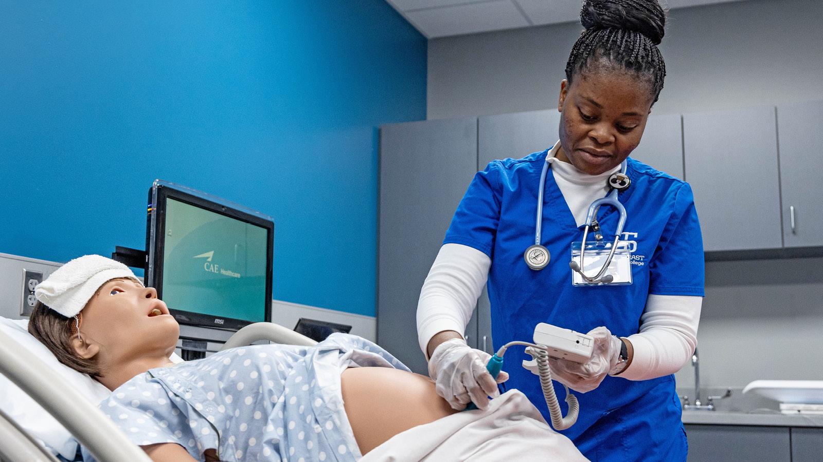 Nursing student performs lab technique at SIM Center