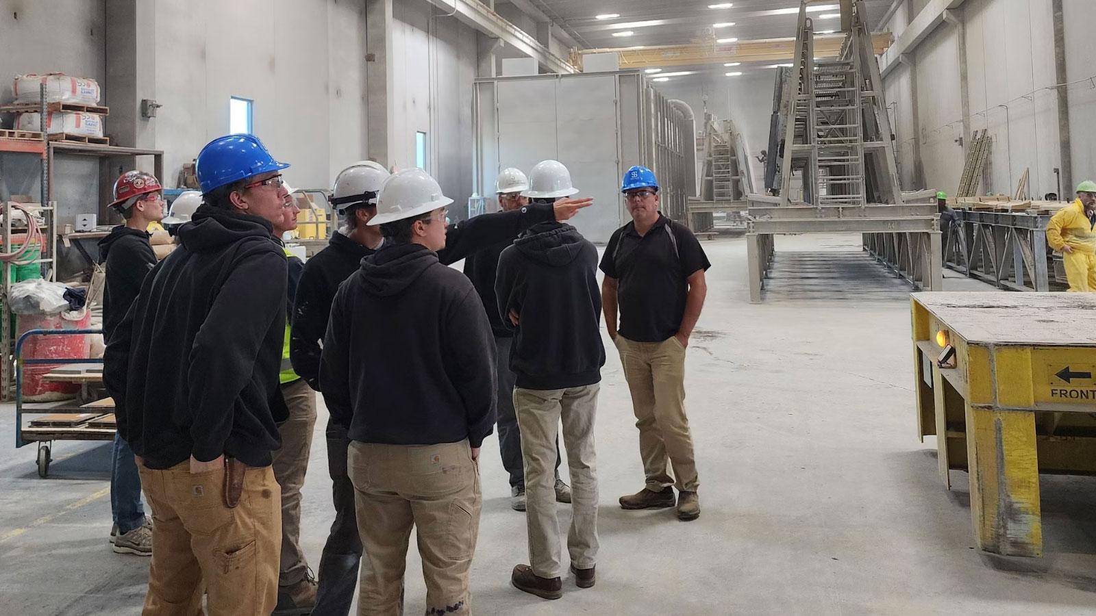 Gage Brothers 7 The Civil Construction class at Southeast Technical College visited Gage Brothers the first week of October to learn about cutting-edge construction techniques. Gage Brothers is a leading construction company in Sioux Falls that works on “building communities and the structures that make up the places people visit, learn, work and play. We manufacture precast concrete that takes on many shapes and forms to structurally support buildings or give them a beautiful exterior facade.” During their visit, the Civil Construction class learned about techniques for forming post and pretensioned concrete, precast construction, bridge beams and columns.