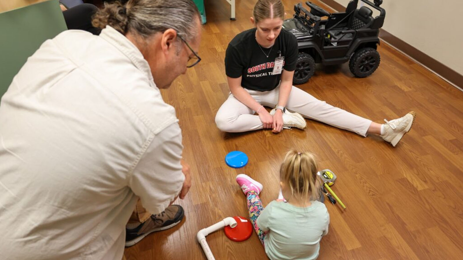 Tanya Liu, assistant professor in USD’s department interacts with a child