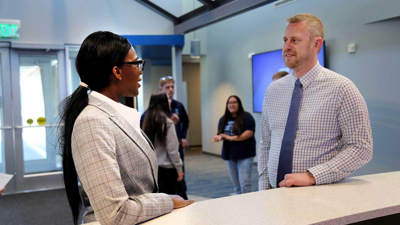 President Clasemann having a discussion with one of our future graduates.