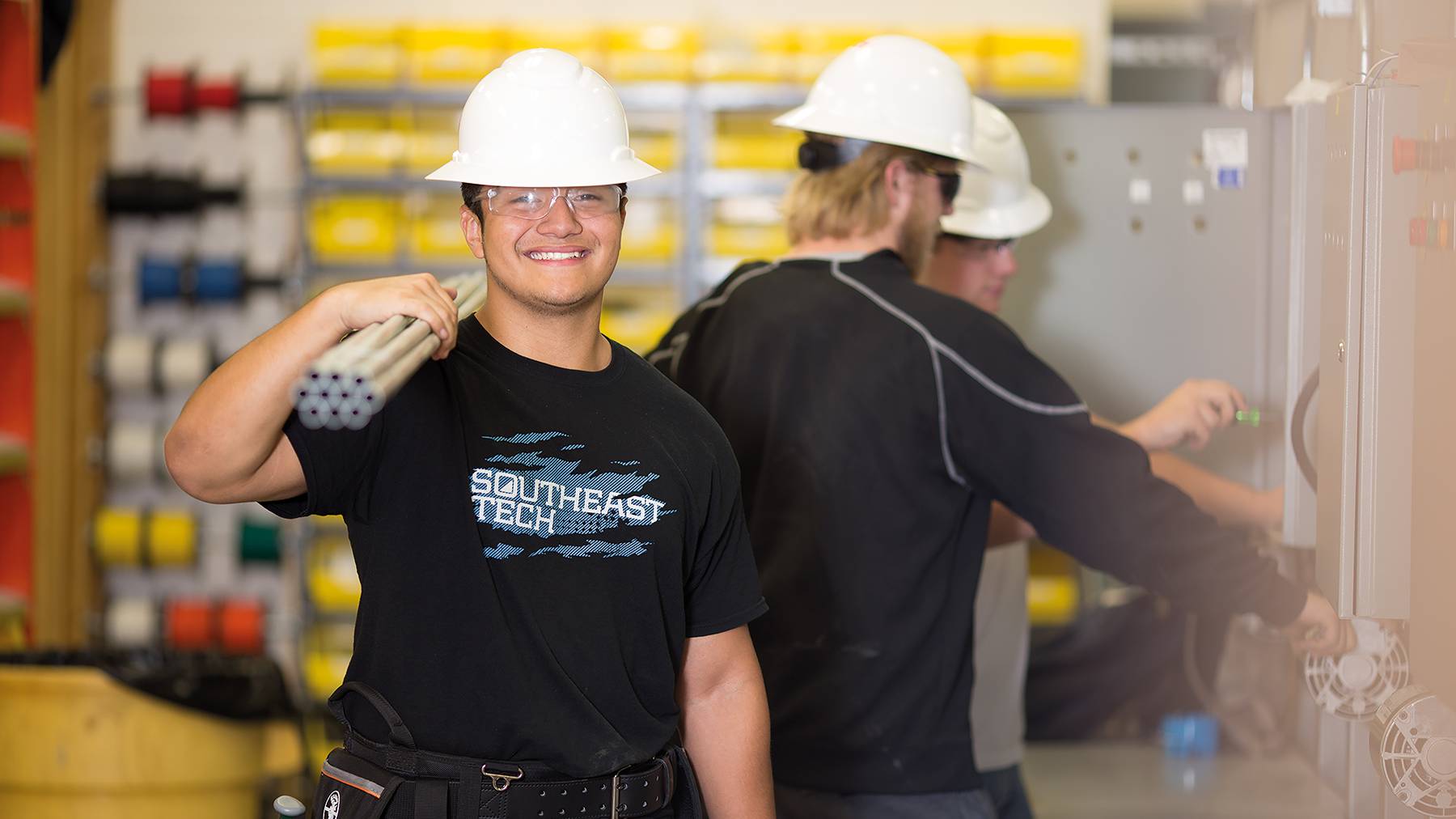 Student on construction site with pipes