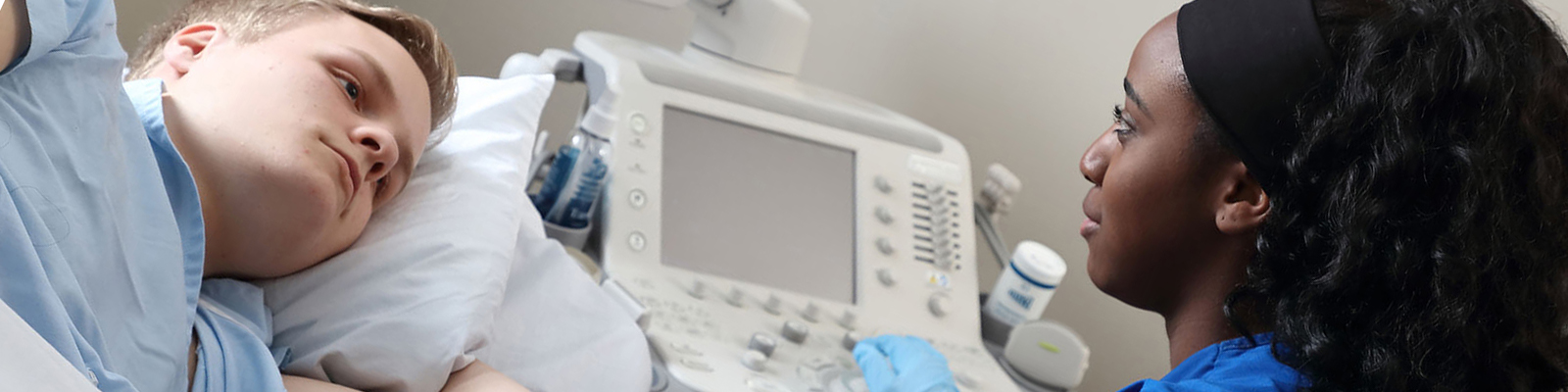 patient and technician with an ultrasound machine