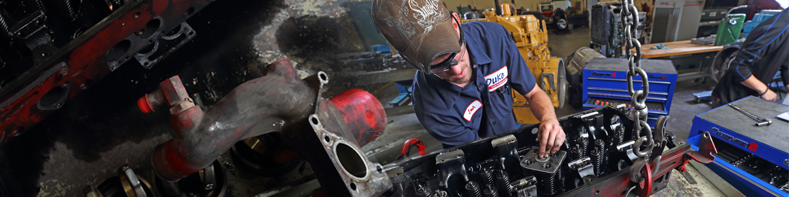 Technician working on a diesel engine