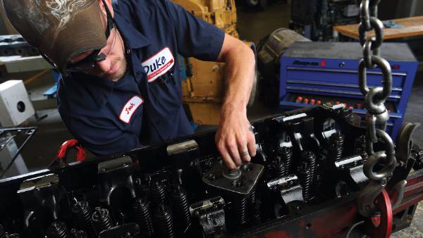 Man working on a diesel engine