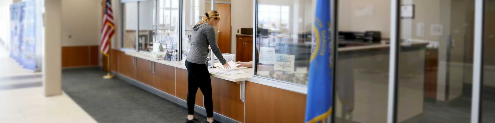 Student conducting a transaction at the business office