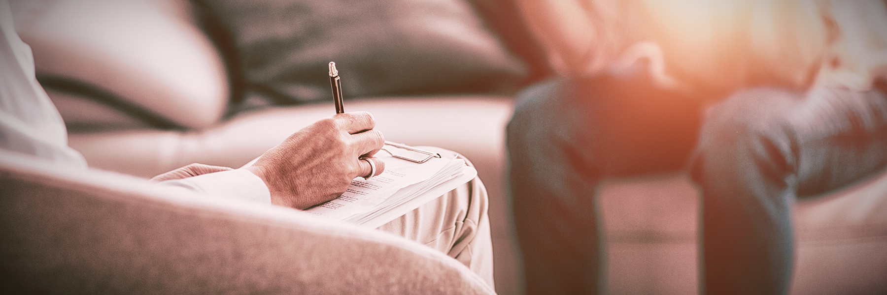 Request Counseling Services Counselor with notepad and pen