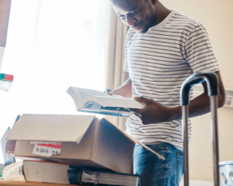 Man with boxes on table