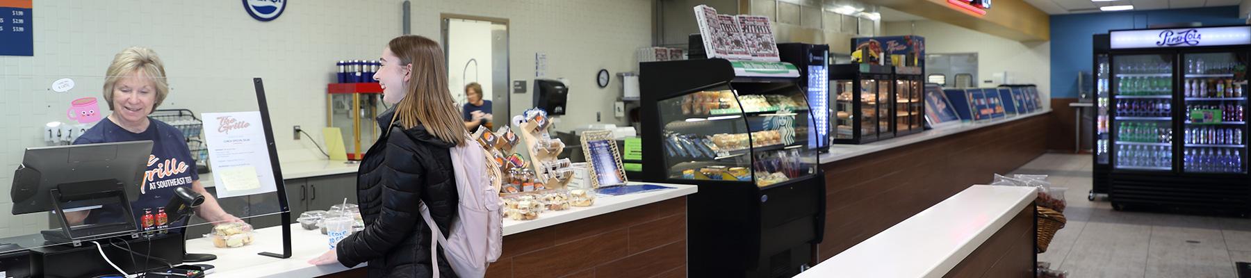 student making a purchase at The Grille