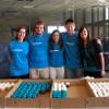 SGA students and coordinator with cupcakes.