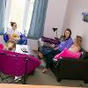 Students visiting in living area of Southeast Tech student apartments.