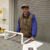 A plumbing student assembles a hurdle for the law enforcement program.
