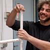 A plumbing student assembles a hurdle for the law enforcement program.