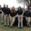 Graphics on a Dodge Charger utilized by the Law Enforcement program recognize the agency that provided them. 
