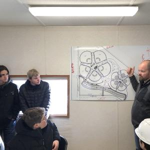 Jesse Tschetter and class on a field trip to Sanford Sports Complex learning Sports Field Construction from management leaders with Mammoth Sport Turf Construction.