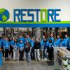 Business students at STC employees volunteer at the Habitat for Humanity ReStore facility.