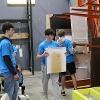 Business students at STC employees volunteer at the Habitat for Humanity ReStore facility.