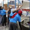 Business students at STC employees volunteer at the Habitat for Humanity ReStore facility.