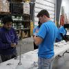 Business students at STC employees volunteer at the Habitat for Humanity ReStore facility.