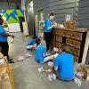 Business students at STC employees volunteer at the Habitat for Humanity ReStore facility.
