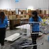 Business students at STC employees volunteer at the Habitat for Humanity ReStore facility.