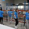Business students at STC employees volunteer at the Habitat for Humanity ReStore facility.