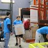 Business students at STC employees volunteer at the Habitat for Humanity ReStore facility.