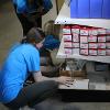 Business students at STC employees volunteer at the Habitat for Humanity ReStore facility.