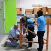 Business students at STC employees volunteer at the Habitat for Humanity ReStore facility.