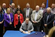 SB79 Signing - Gov. Smiles